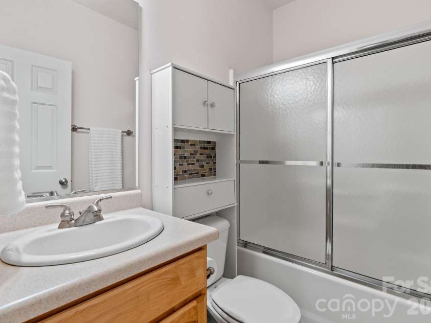 112 Chestnut Lane, Hendersonville, NC 28792.  MLS# CAR4369682, YatesRealty ID 18244. Bathroom 2 with shower and storage.
