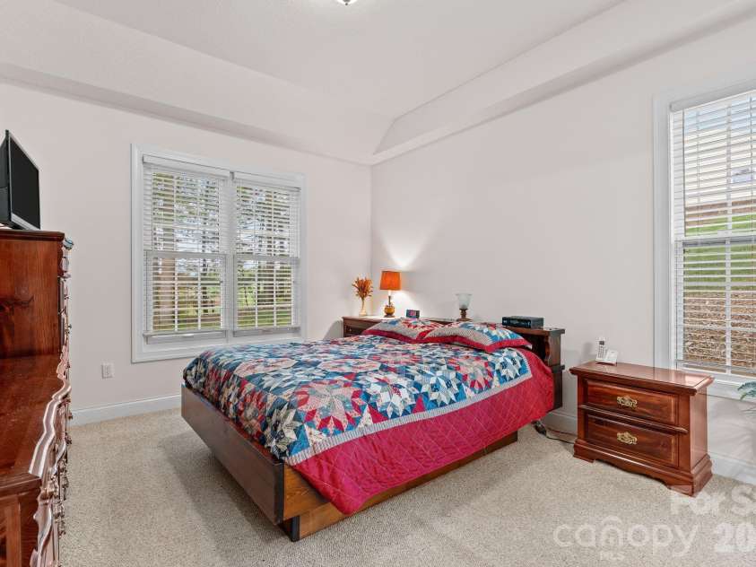 112 Chestnut Lane, Hendersonville, NC 28792.  MLS# CAR4369682, YatesRealty ID 18244. Primary bedroom with tray-like ceiling.