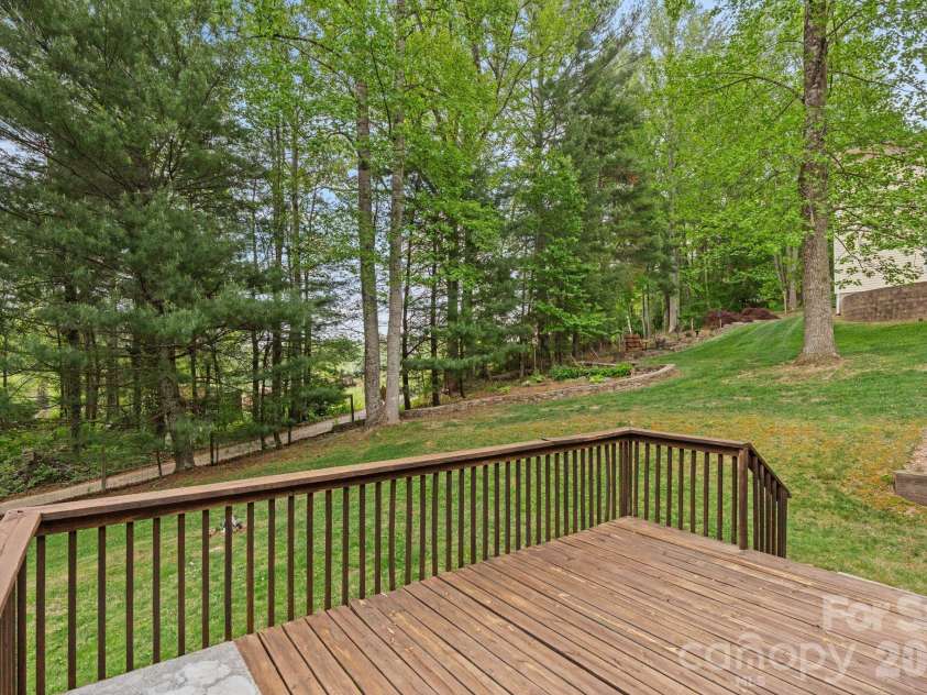 112 Chestnut Lane, Hendersonville, NC 28792.  MLS# CAR4369682, YatesRealty ID 18244. View from deck to backyard.