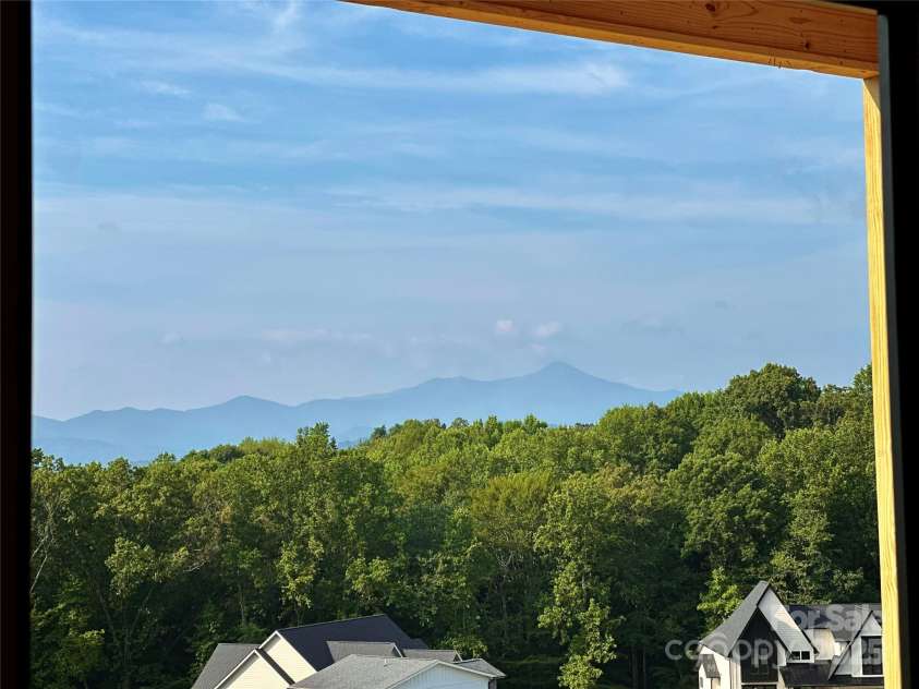 51 Bridgeway Drive, Candler, NC 28715.  MLS# CAR4258598, YatesRealty ID 18249. View from the back porch