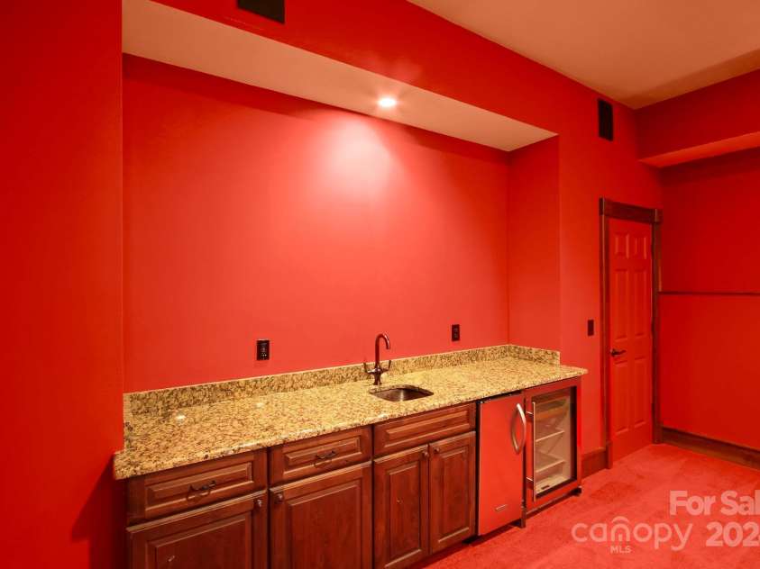 691 Dogwood Lane, Blowing Rock, NC 28605.  MLS# CAR4131831, YatesRealty ID 1825. Lower-level theater room - wet bar!