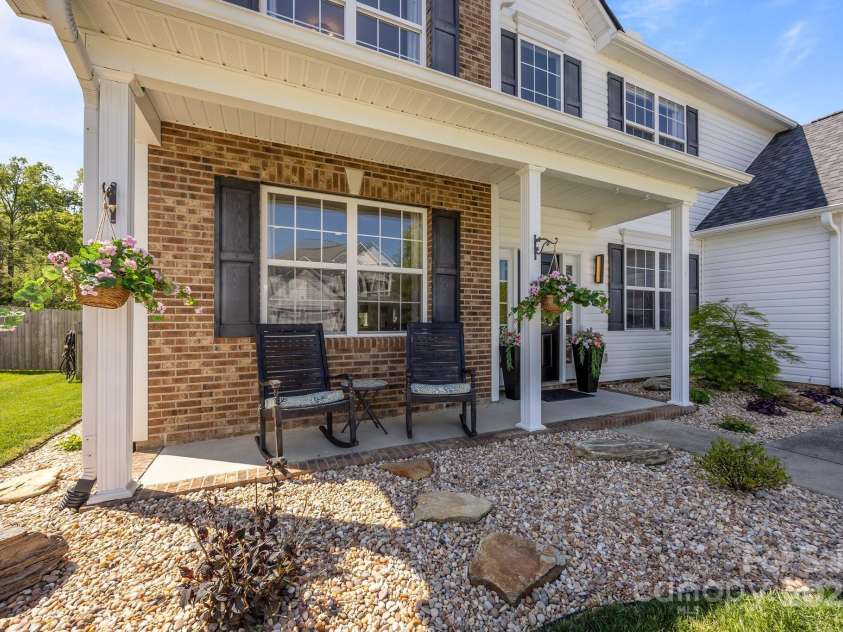 347 Wildbriar Road, Fletcher, NC 28732.  MLS# CAR4250812, YatesRealty ID 18254. Charming covered front porch enhances the home’s curb appeal, offering a welcoming entry and nice architectural detail