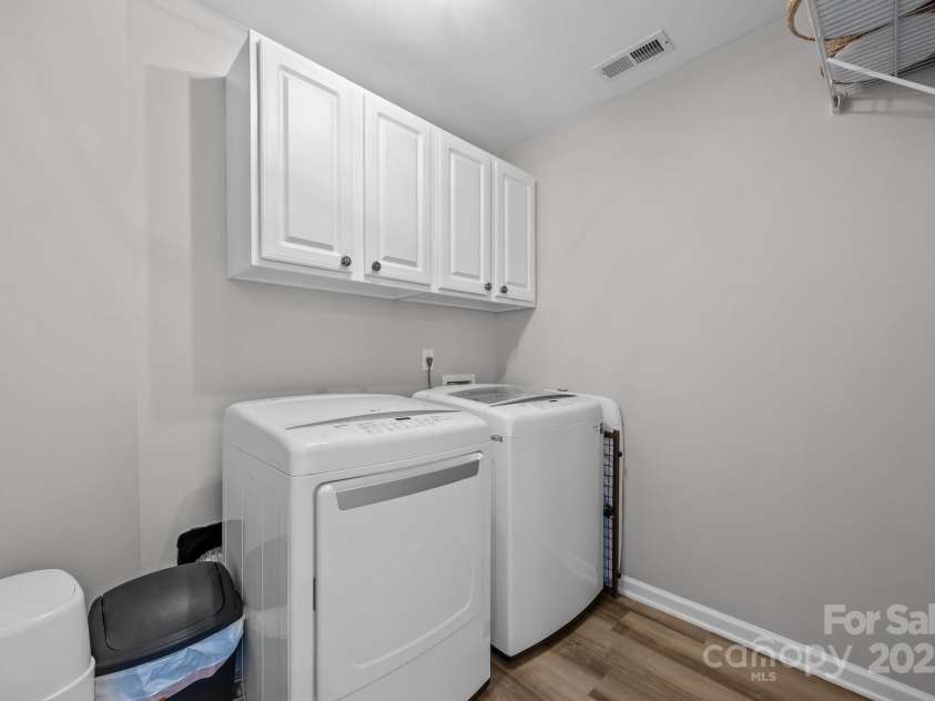 347 Wildbriar Road, Fletcher, NC 28732.  MLS# CAR4250812, YatesRealty ID 18254. Convenient 2nd Level Laundry with built-in cabinetry and vinyl laminate flooring