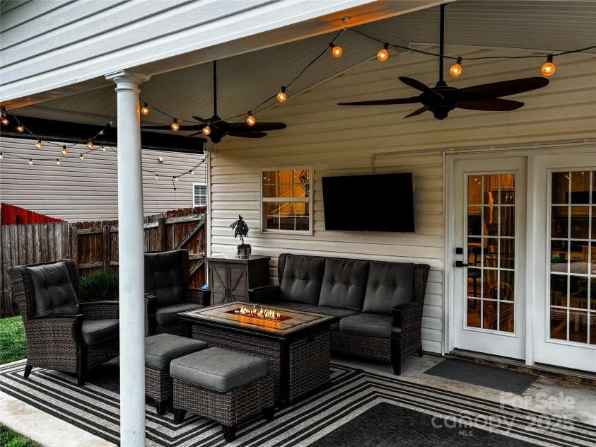 347 Wildbriar Road, Fletcher, NC 28732.  MLS# CAR4250812, YatesRealty ID 18254. Covered Patio overlooking pool and lush backyard
