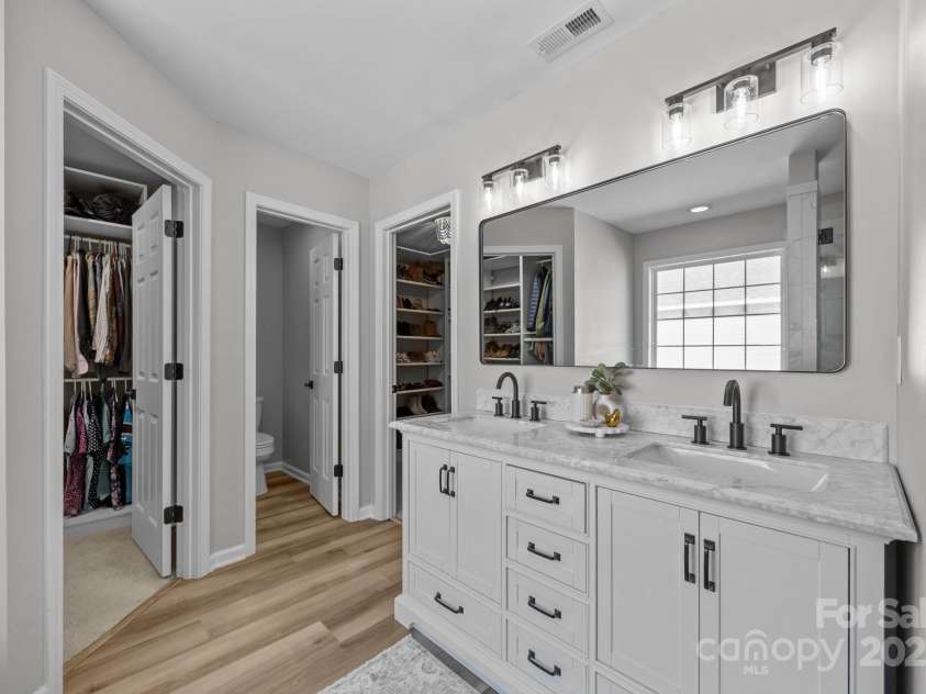 347 Wildbriar Road, Fletcher, NC 28732.  MLS# CAR4250812, YatesRealty ID 18254. En-suite Bath opens to private water closet flanked by newly designed his and her closets