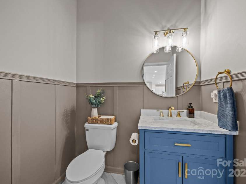 347 Wildbriar Road, Fletcher, NC 28732.  MLS# CAR4250812, YatesRealty ID 18254. Hall Bath features custom moldings, undated vanity and hardware