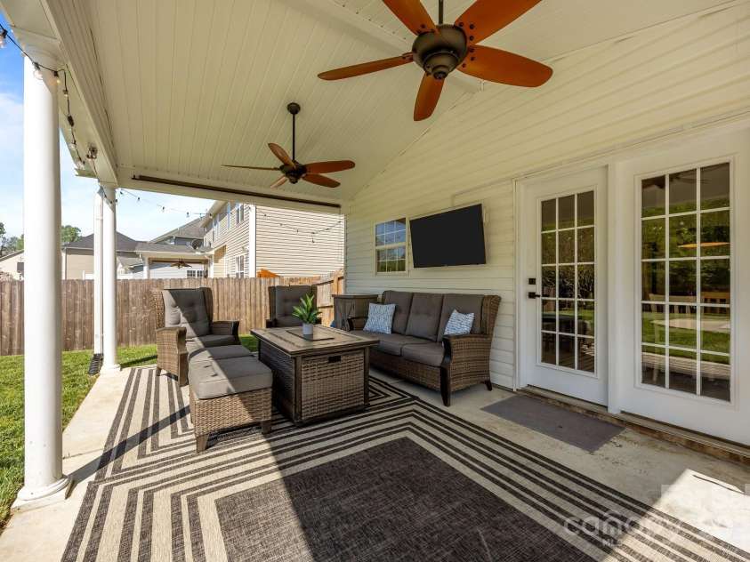 347 Wildbriar Road, Fletcher, NC 28732.  MLS# CAR4250812, YatesRealty ID 18254. Rear covered patio with new fans and sun shade overlooks the pool area