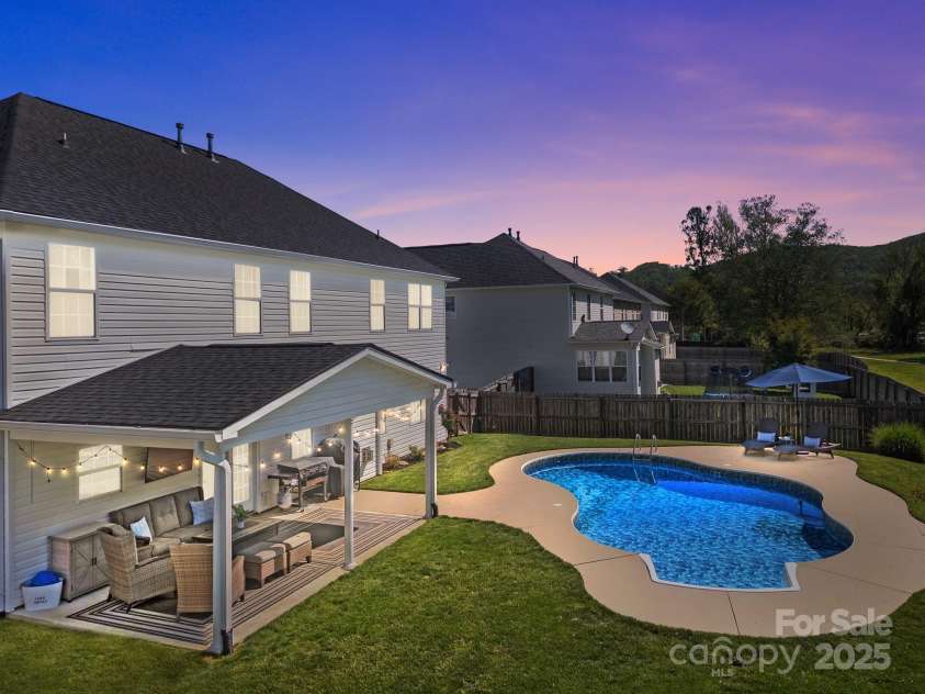 347 Wildbriar Road, Fletcher, NC 28732.  MLS# CAR4250812, YatesRealty ID 18254. Welcome to 347 Wildbriar Road - your mountainside swimming pool oasis awaits.