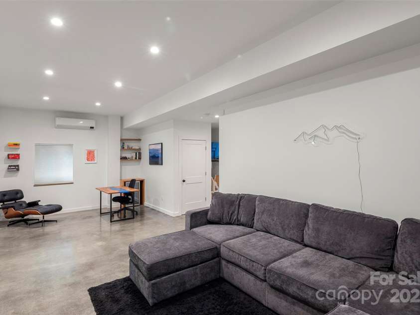 79 Euclid Boulevard, Asheville, NC 28806.  MLS# CAR4253101, YatesRealty ID 18258. An energy efficient mini split provides ample air circulation for the lower level