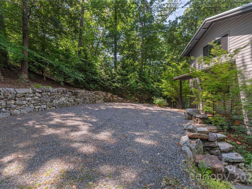 79 Euclid Boulevard, Asheville, NC 28806.  MLS# CAR4253101, YatesRealty ID 18258. Gravel drive with space for 4 large cars and more parking on the street