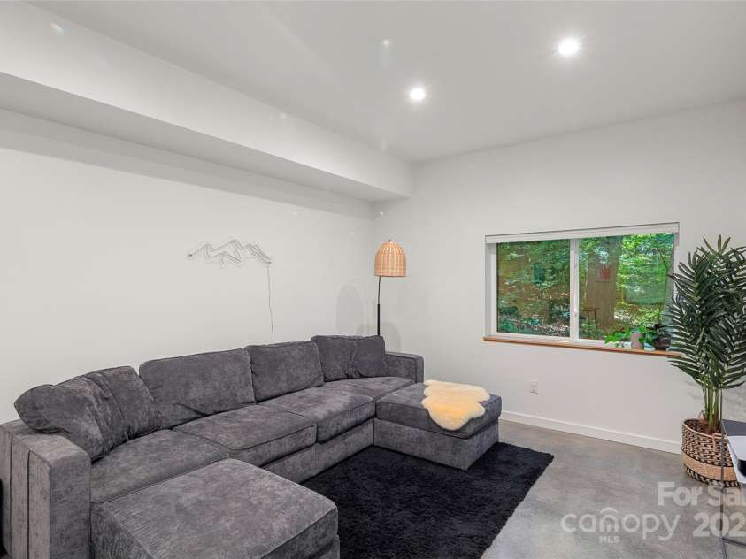 79 Euclid Boulevard, Asheville, NC 28806.  MLS# CAR4253101, YatesRealty ID 18258. High ceilings and dimmable canned lights throughout the lower level