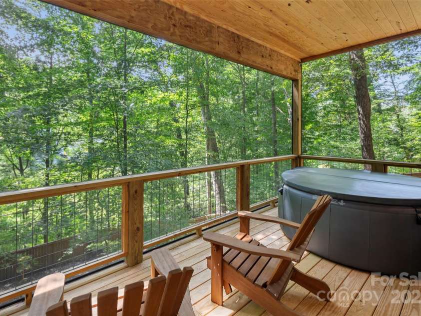 79 Euclid Boulevard, Asheville, NC 28806.  MLS# CAR4253101, YatesRealty ID 18258. Screened in porch with so much privacy off the lower level