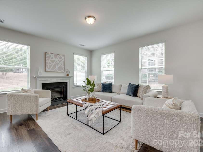 5836 Clan Maclaine Drive, Charlotte, NC 28278.  MLS# CAR4259944, YatesRealty ID 18274. Family Room with Fireplace and tons of natural light