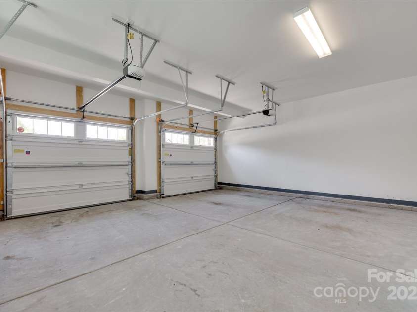 5836 Clan Maclaine Drive, Charlotte, NC 28278.  MLS# CAR4259944, YatesRealty ID 18274. Oversized 2 car garage with Storage Shelves to Convey