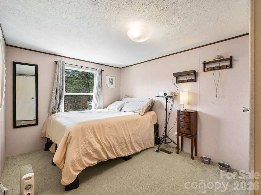 3509 Gabriels Creek Road, Mars Hill, NC 28754.  MLS# CAR4353176, YatesRealty ID 18281. Queen sized bed