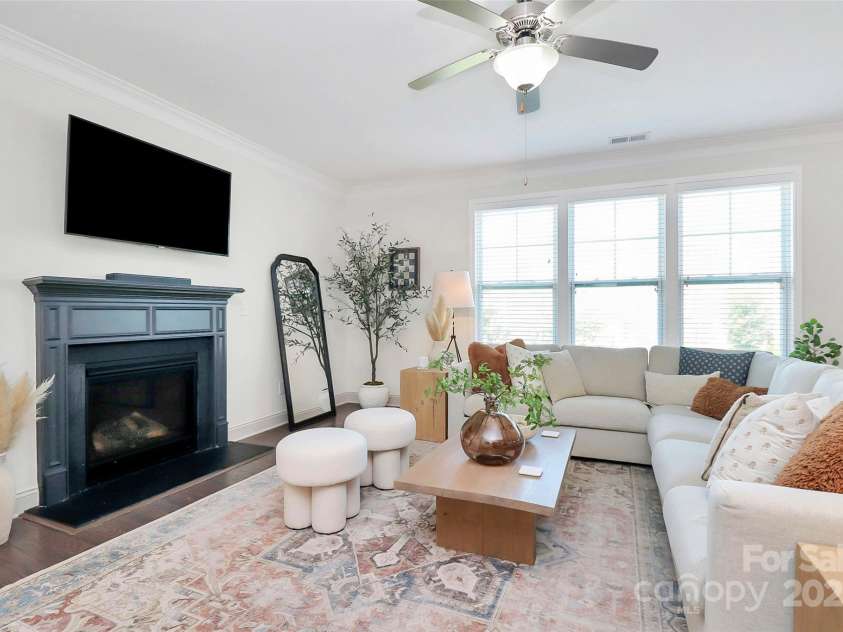 8916 Inverness Bay Road, Charlotte, NC 28278.  MLS# CAR4258017, YatesRealty ID 18286. Gas log fireplace elevates this living room