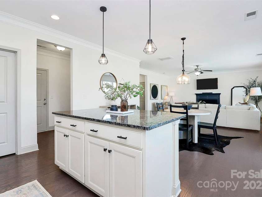 8916 Inverness Bay Road, Charlotte, NC 28278.  MLS# CAR4258017, YatesRealty ID 18286. Storage at the kitchen island and a large pantry offer tons of space for all your cooking tools