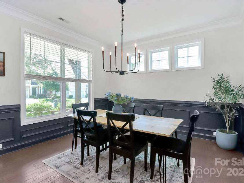 8916 Inverness Bay Road, Charlotte, NC 28278.  MLS# CAR4258017, YatesRealty ID 18286. Tons of natural light in the dining room with an upgraded, stylish chandelier