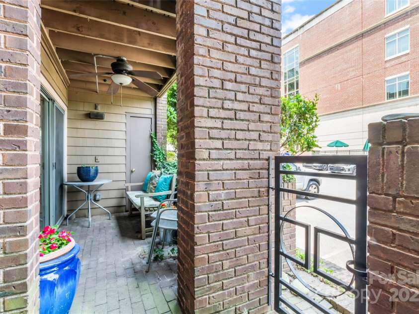 1101 Morehead Street, Charlotte, NC 28204.  MLS# CAR4276615, YatesRealty ID 18298. Back patio w/ city views & a gate/steps to parking lot