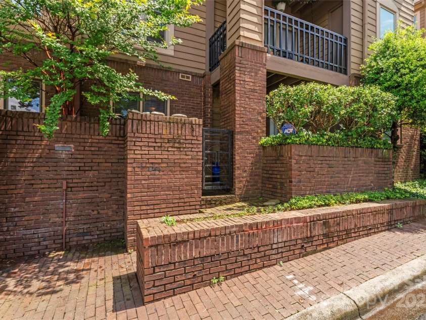 1101 Morehead Street, Charlotte, NC 28204.  MLS# CAR4276615, YatesRealty ID 18298. Condo can be accessed via the gate on patio