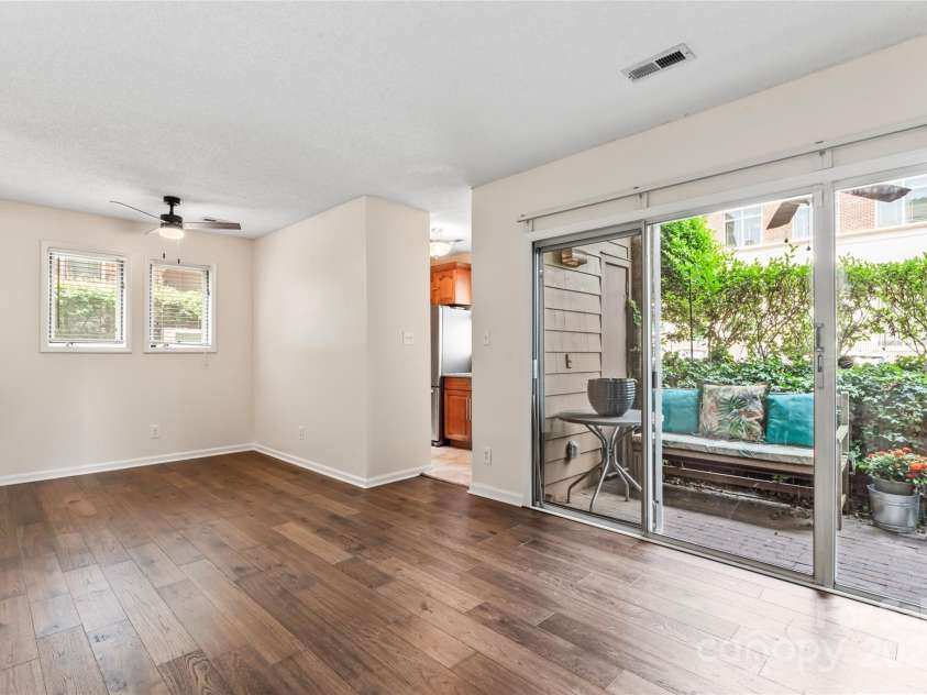 1101 Morehead Street, Charlotte, NC 28204.  MLS# CAR4276615, YatesRealty ID 18298. Living Room Opens up to your patio w/ city views