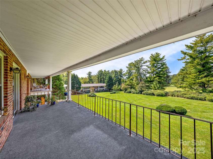 410 Golf View Condo Lane, Hendersonville, NC 28739.  MLS# CAR4267713, YatesRealty ID 18302. Balcony with Golf Course and lawn view