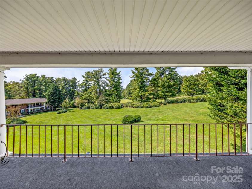 410 Golf View Condo Lane, Hendersonville, NC 28739.  MLS# CAR4267713, YatesRealty ID 18302. Balcony with Golf Course and lawn view