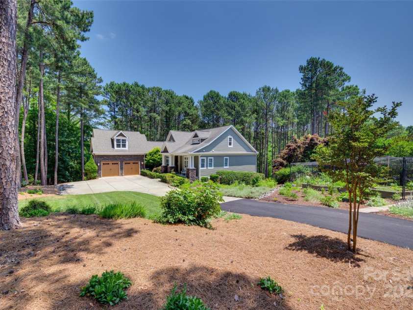 18311 Rosapenny Road, Charlotte, NC 28278.  MLS# CAR4256637, YatesRealty ID 18305. Beautifully landscaped yard with expansive gardens and a 6-zone irrigation system for effortless, year-round maintenance and curb appeal.