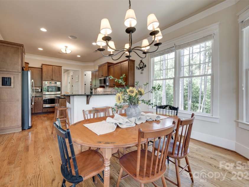 18311 Rosapenny Road, Charlotte, NC 28278.  MLS# CAR4256637, YatesRealty ID 18305. Enjoy casual meals bathed in natural light, with seamless flow into a spacious, well-appointed kitchen.