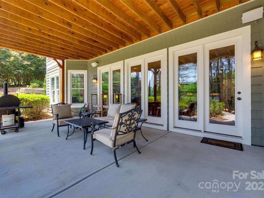 18311 Rosapenny Road, Charlotte, NC 28278.  MLS# CAR4256637, YatesRealty ID 18305. Spacious covered patio with direct access from the lower level—perfect for grilling, lounging, and enjoying peaceful backyard views.