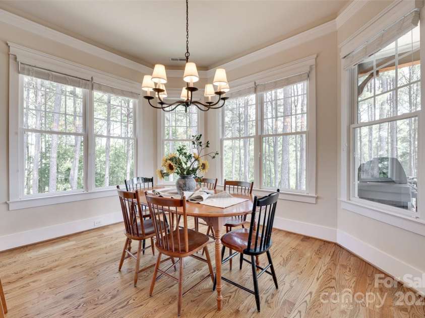 18311 Rosapenny Road, Charlotte, NC 28278.  MLS# CAR4256637, YatesRealty ID 18305. Start your mornings in this cheerful bay-windowed nook with panoramic wooded views—your perfect coffee corner.