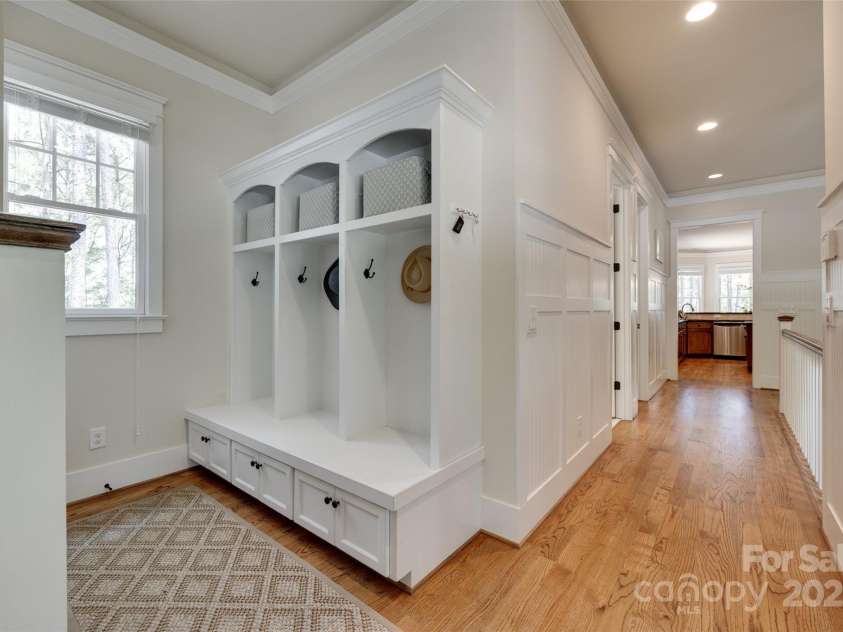 18311 Rosapenny Road, Charlotte, NC 28278.  MLS# CAR4256637, YatesRealty ID 18305. Well-appointed garage entry hall with built-in drop zone featuring lockers, bench seating, and storage—perfect for everyday convenience and organization.