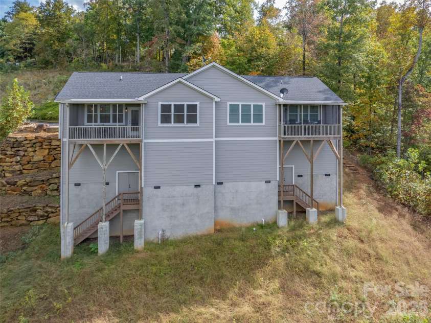 146 Red Hawk Knoll, Lake Lure, NC 28746.  MLS# CAR4334221, YatesRealty ID 18311. Back of unit with storage room below