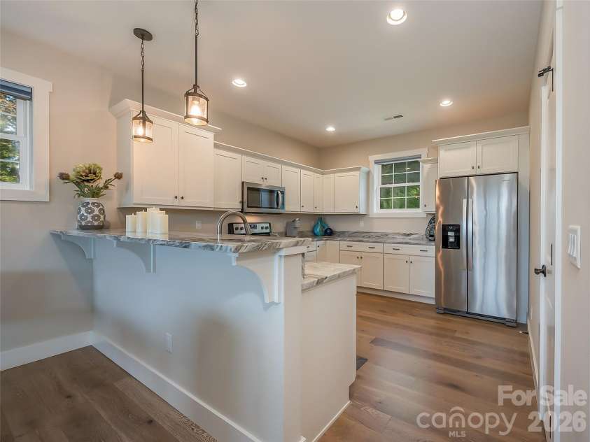 146 Red Hawk Knoll, Lake Lure, NC 28746.  MLS# CAR4334221, YatesRealty ID 18311. Kitchen with breakfast bar