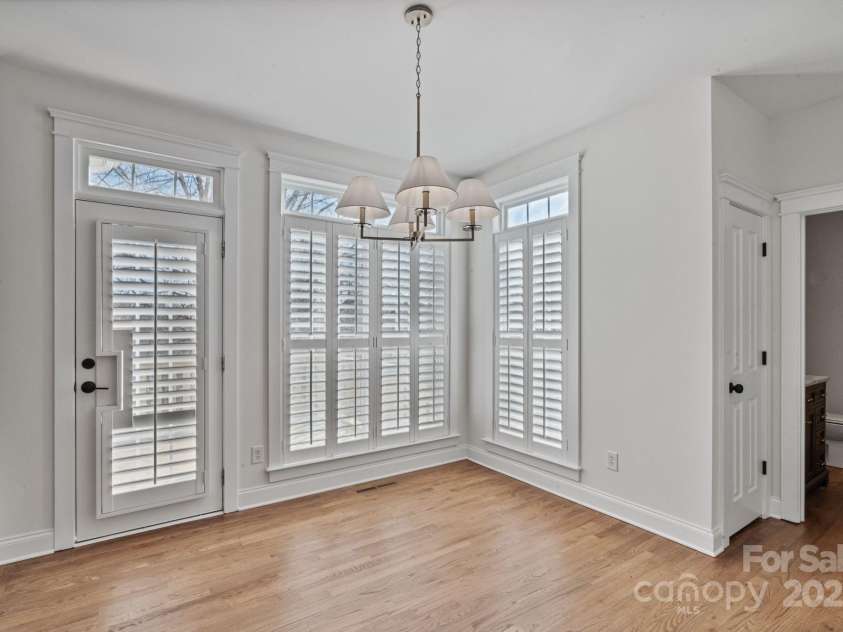 506 Academy Street, McAdenville, NC 28101.  MLS# CAR4330594, YatesRealty ID 18316. Door exiting to outdoor deck off the breakfast area.