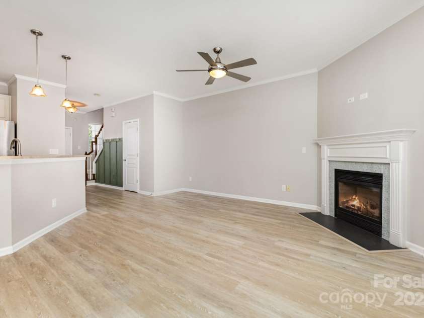230 Dawn Mist Lane, Fort Mill, SC 29708.  MLS# CAR4264170, YatesRealty ID 18317. Townhome is beautifully updated with luxury vinyl plank floors, updated fan and fireplace surround!