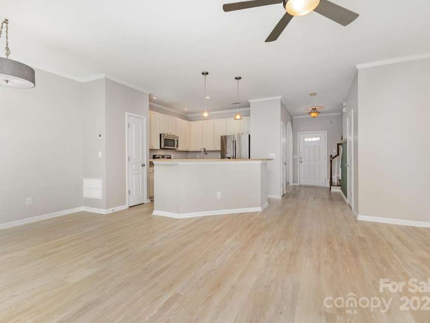 230 Dawn Mist Lane, Fort Mill, SC 29708.  MLS# CAR4264170, YatesRealty ID 18317. Updated fixtures for living room, kitchen and eat-in kitchen area.