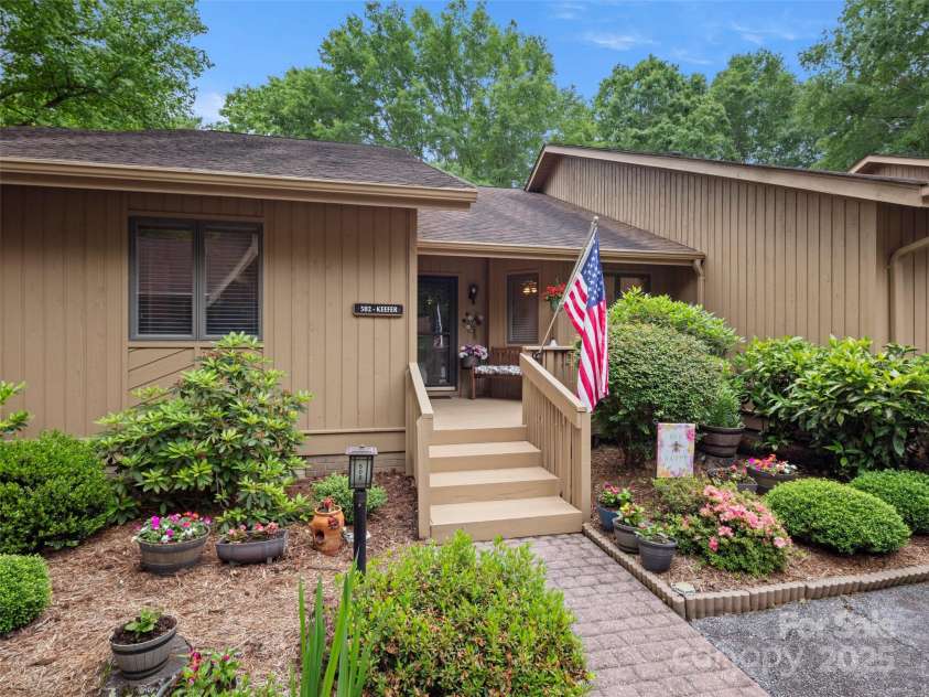 502 Spanish Oak Lane, Hendersonville, NC 28791.  MLS# CAR4260697, YatesRealty ID 18322. Lush Landscaping at Entry