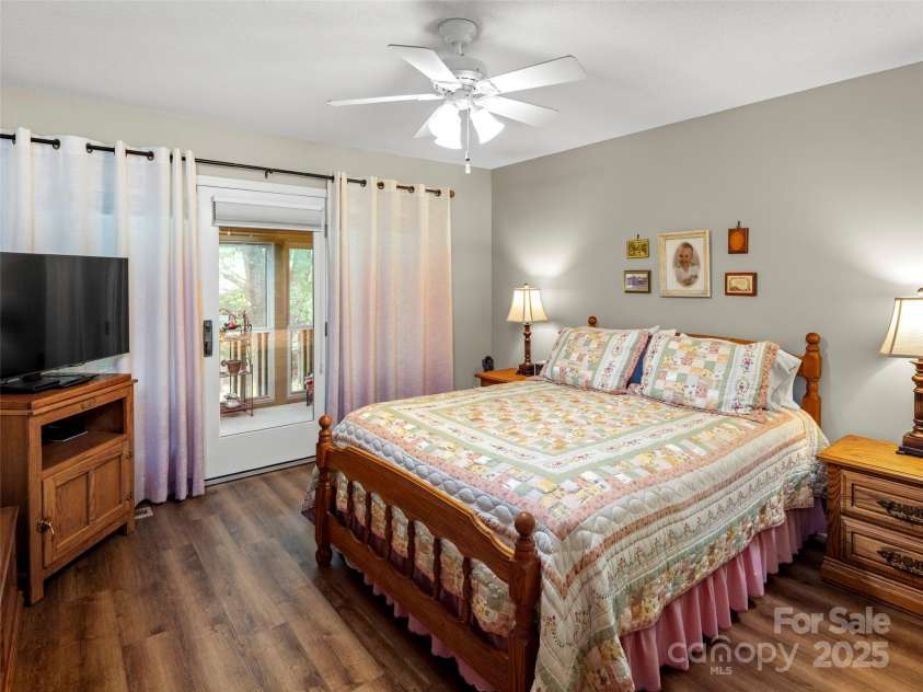 502 Spanish Oak Lane, Hendersonville, NC 28791.  MLS# CAR4260697, YatesRealty ID 18322. Primary Suite Leading to Sunroom