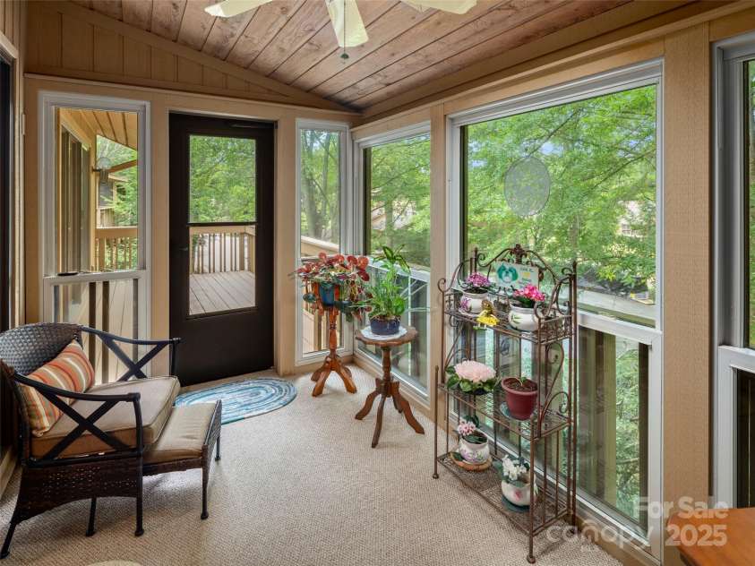 502 Spanish Oak Lane, Hendersonville, NC 28791.  MLS# CAR4260697, YatesRealty ID 18322. Relax in 3 Season Sunroom with Treehouse Feel