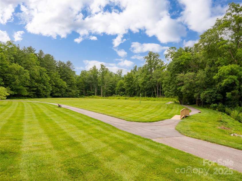 502 Spanish Oak Lane, Hendersonville, NC 28791.  MLS# CAR4260697, YatesRealty ID 18322. Trail Around Pond and Creek