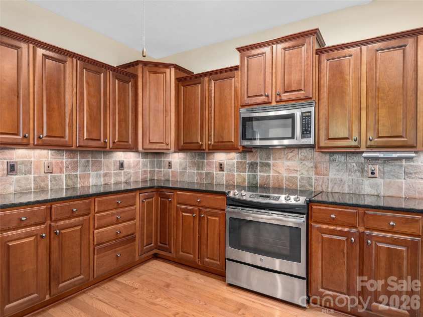 54 Deep Valley Lane, Hendersonville, NC 28791.  MLS# CAR4304196, YatesRealty ID 18323. Kitchen open to Great Room