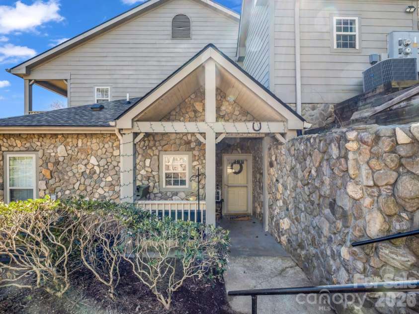 158 Stonecrest Court, Lake Lure, NC 28746.  MLS# CAR4230404, YatesRealty ID 1833. Steps down to entry