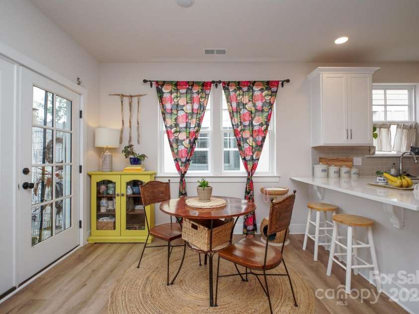 711 Beaty Street, Davidson, NC 28036.  MLS# CAR4261256, YatesRealty ID 18333. Kitchen, Dining, and Patio