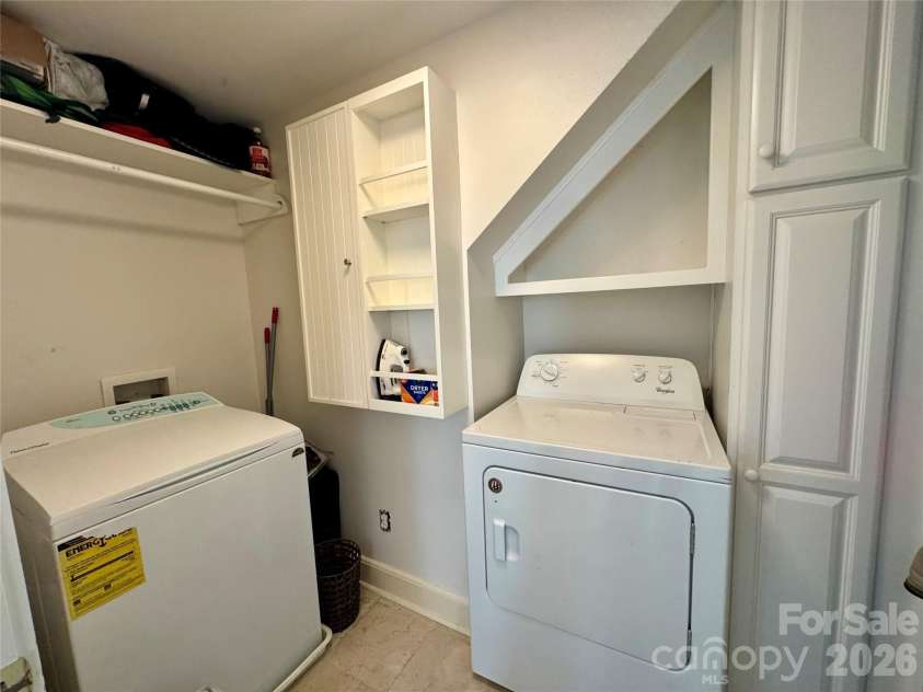 135 Eastover Drive, Concord, NC 28025.  MLS# CAR4372320, YatesRealty ID 18335. Laundry room with storage upstairs