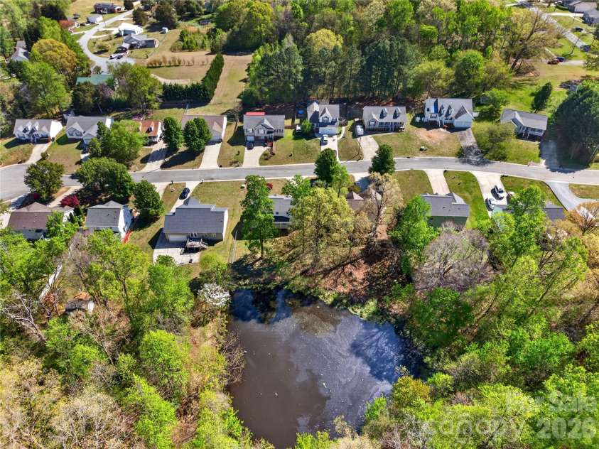 7 Collin Lane, Thomasville, NC 27360.  MLS# CAR4369183, YatesRealty ID 18344. Drone pond shot