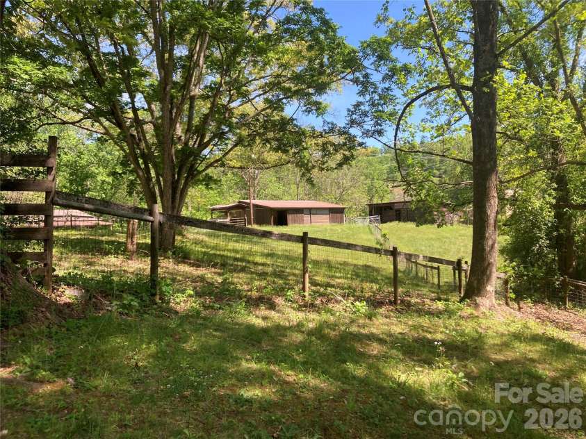 344 Mills River Road, Mills River, NC 28759.  MLS# CAR4374201, YatesRealty ID 18346. Pasture and horse barn