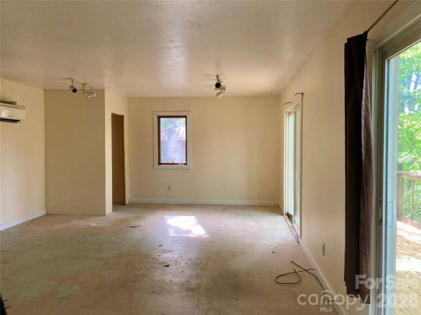 344 Mills River Road, Mills River, NC 28759.  MLS# CAR4374201, YatesRealty ID 18346. Studio ready for flooring with deck and workshop