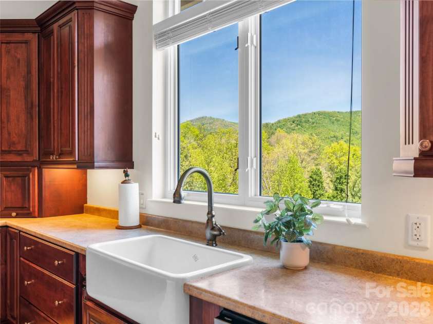 16 Chickadee Lane, Fairview, NC 28730.  MLS# CAR4375126, YatesRealty ID 18349. Chef's kitchen with a view