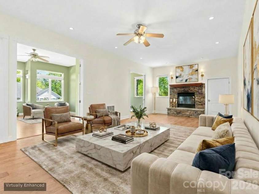 16 Chickadee Lane, Fairview, NC 28730.  MLS# CAR4375126, YatesRealty ID 18349. Cozy fireplace seating area